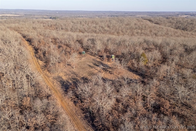 birds eye view of property with a rural view