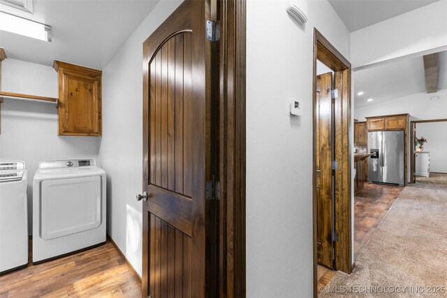 7202 E 148, Allen, OK 74825 - washroom with washer and dryer, cabinet space, and wood finished floors
