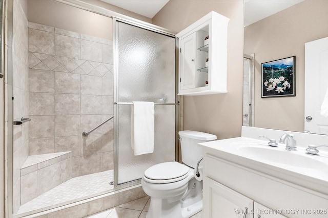 11748 S Canton Ave, Tulsa, OK 74137 - full bathroom with toilet, vanity, tile patterned floors, and a shower stall