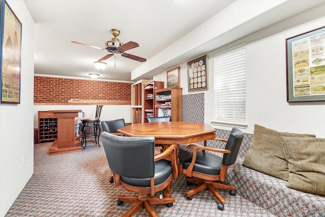 11748 S Canton Ave, Tulsa, OK 74137 - carpeted dining room with brick wall and ceiling fan