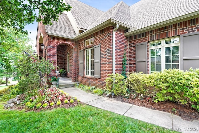 11748 S Canton Ave, Tulsa, OK 74137 - doorway to property featuring brick siding and roof with shingles
