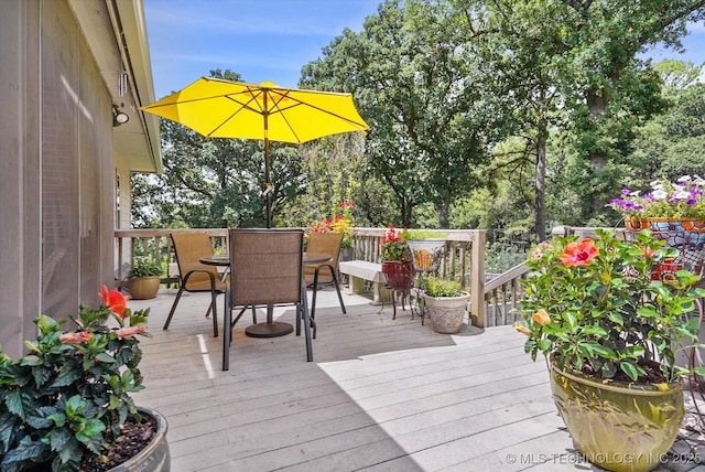 11748 S Canton Ave, Tulsa, OK 74137 - wooden terrace featuring outdoor dining area