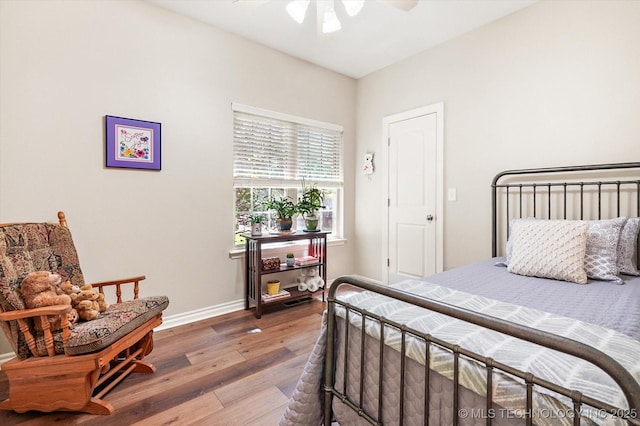 11748 S Canton Ave, Tulsa, OK 74137 - bedroom with baseboards, wood finished floors, and ceiling fan