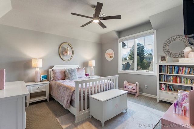 bedroom featuring baseboards, a ceiling fan, light carpet, and lofted ceiling