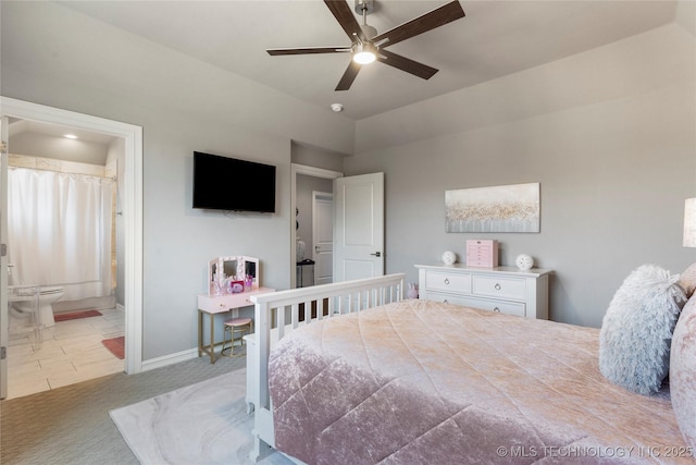 carpeted bedroom with baseboards, lofted ceiling, and connected bathroom
