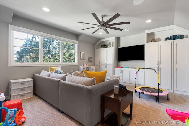 living area with a ceiling fan, visible vents, recessed lighting, carpet flooring, and lofted ceiling