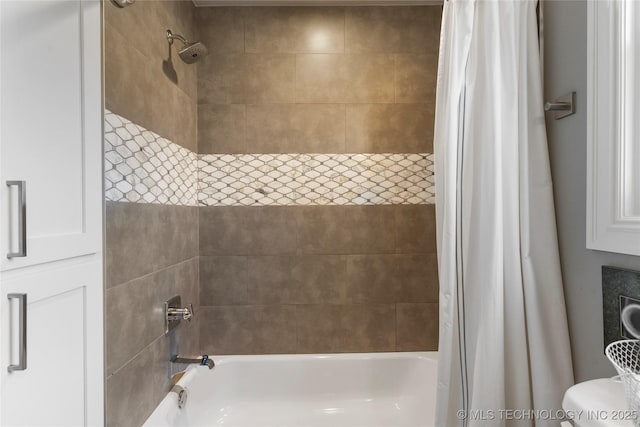 bathroom featuring toilet and shower / bath combo with shower curtain