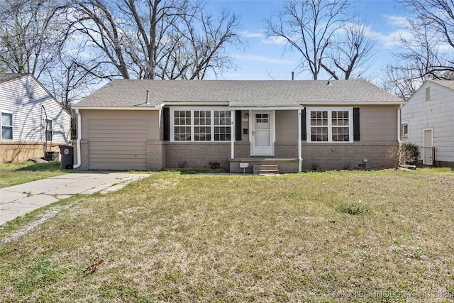 4641 S Trenton Ave, Tulsa, OK 74105 - view of front of home featuring brick siding, crawl space, and a front yard