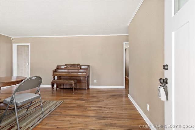 4641 S Trenton Ave, Tulsa, OK 74105 - office area featuring baseboards, wood finished floors, and crown molding