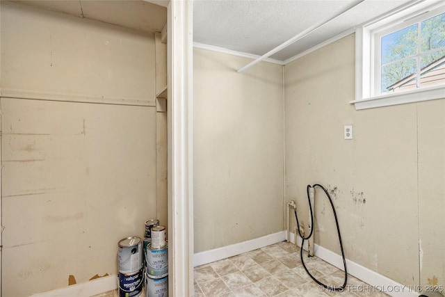 4641 S Trenton Ave, Tulsa, OK 74105 - laundry room with baseboards and a textured ceiling