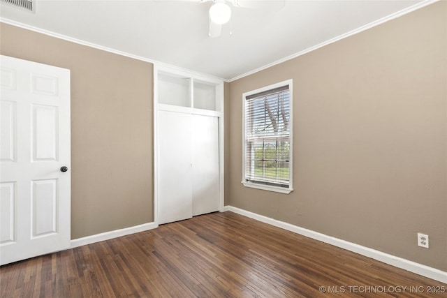 4641 S Trenton Ave, Tulsa, OK 74105 - unfurnished bedroom featuring wood finished floors, a closet, baseboards, and visible vents