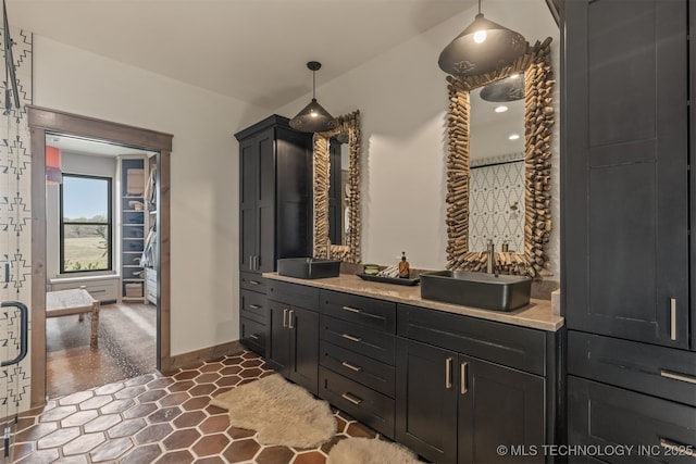 22450 S Rocky Ridge Ln, Claremore, OK 74019 - full bathroom featuring vanity and baseboards