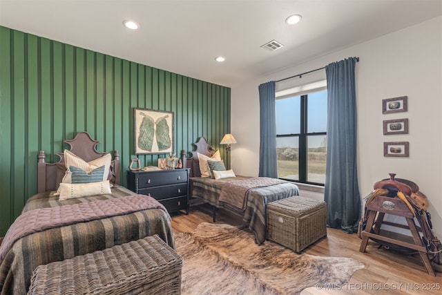 22450 S Rocky Ridge Ln, Claremore, OK 74019 - bedroom featuring an accent wall, recessed lighting, and wood finished floors