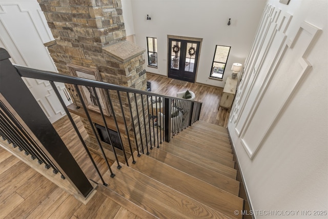 22450 S Rocky Ridge Ln, Claremore, OK 74019 - staircase with wood finished floors and a towering ceiling