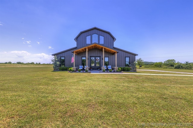22450 S Rocky Ridge Ln, Claremore, OK 74019 - rear view of property featuring french doors, board and batten siding, and a lawn