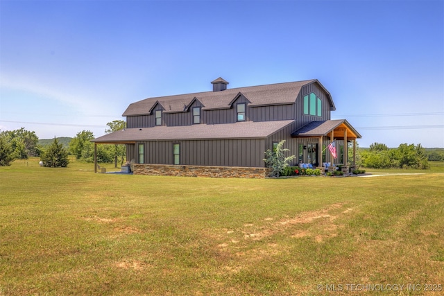 22450 S Rocky Ridge Ln, Claremore, OK 74019 - back of house with a lawn, board and batten siding, and roof with shingles