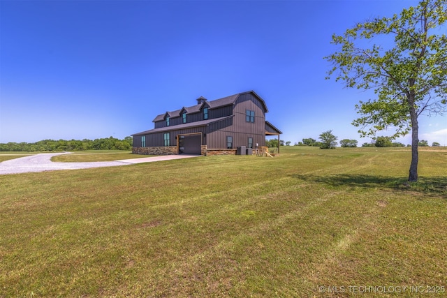 22450 S Rocky Ridge Ln, Claremore, OK 74019 - rear view of house with driveway, a lawn, and stone siding