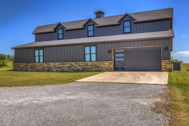 22450 S Rocky Ridge Ln, Claremore, OK 74019 - view of front of house with concrete driveway, stone siding, central AC, a front lawn, and a shingled roof