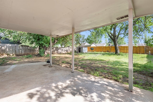 212 W 17th St, Owasso, OK 74055 - view of patio featuring an outdoor structure, a shed, and a fenced backyard