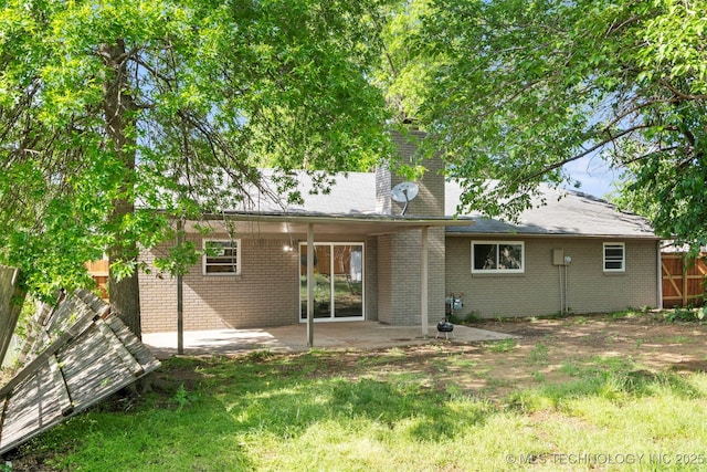 212 W 17th St, Owasso, OK 74055 - rear view of property with fence, a chimney, a patio area, and brick siding