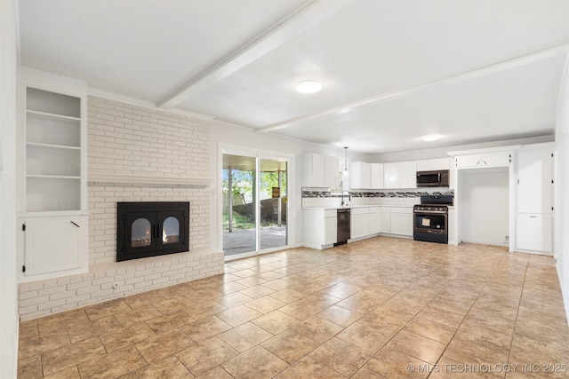 212 W 17th St, Owasso, OK 74055 - kitchen with tasteful backsplash, light countertops, white cabinets, open floor plan, and stainless steel appliances