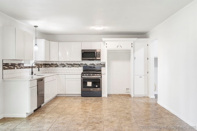 212 W 17th St, Owasso, OK 74055 - kitchen with tasteful backsplash, light countertops, a sink, white cabinets, and stainless steel appliances