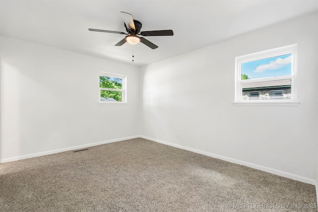 212 W 17th St, Owasso, OK 74055 - carpeted empty room with visible vents, a ceiling fan, and baseboards
