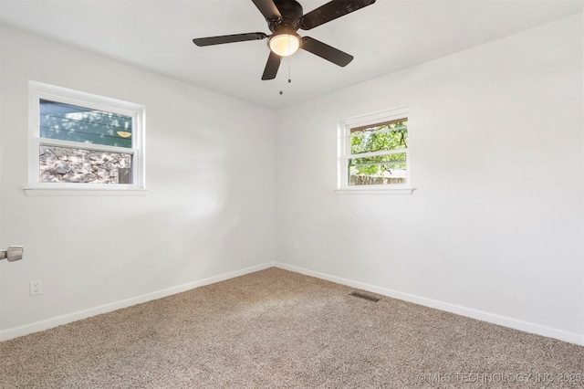 212 W 17th St, Owasso, OK 74055 - spare room featuring baseboards, carpet flooring, ceiling fan, and visible vents