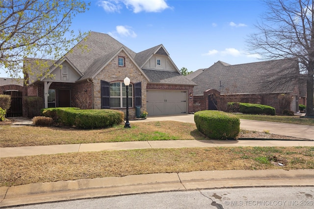9707 E 90th Ct N, Owasso, OK 74055 - view of front of property featuring brick siding, concrete driveway, and a shingled roof