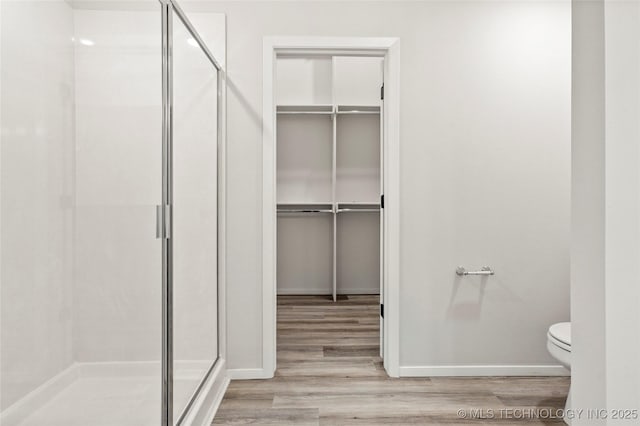 13119 S 72nd E Pl, Bixby, OK 74008 - bathroom with wood finished floors, baseboards, a stall shower, and toilet