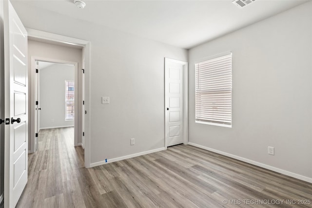 13119 S 72nd E Pl, Bixby, OK 74008 - unfurnished bedroom featuring baseboards, visible vents, and light wood-style flooring