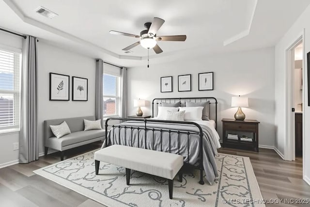 13119 S 72nd E Pl, Bixby, OK 74008 - bedroom featuring a raised ceiling, wood finished floors, and ceiling fan