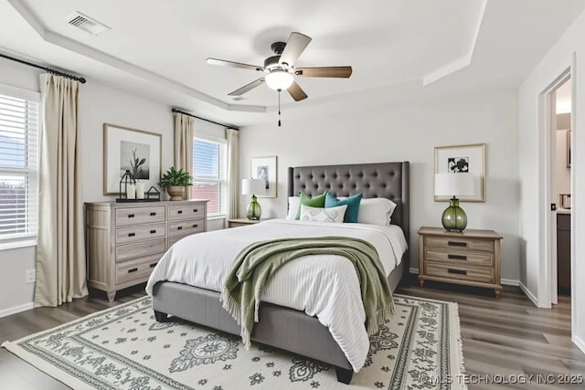 13119 S 72nd E Pl, Bixby, OK 74008 - bedroom with a raised ceiling, dark wood finished floors, and a ceiling fan