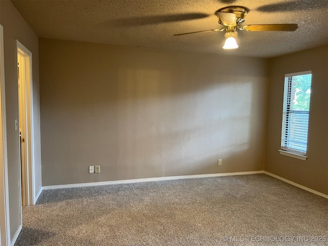 empty room with baseboards, carpet floors, a textured ceiling, and a ceiling fan
