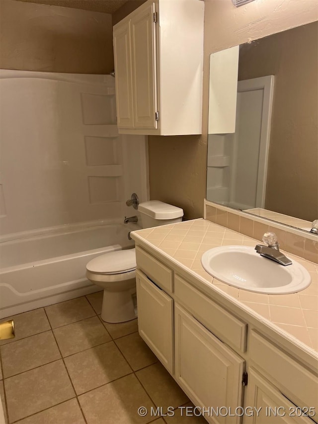 full bathroom with shower / tub combination, tile patterned flooring, vanity, and toilet