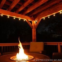 8700 S Union Ave, Tulsa, OK 74132 - exterior space featuring an outdoor fire pit
