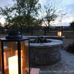 8700 S Union Ave, Tulsa, OK 74132 - view of patio featuring an outdoor fire pit and fence