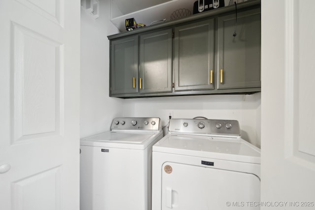 laundry area featuring cabinet space and separate washer and dryer