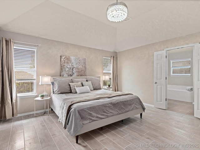 bedroom featuring baseboards, an inviting chandelier, and wood tiled floor
