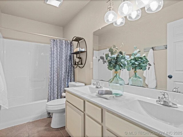 bathroom featuring toilet, shower / bath combination with curtain, a sink, and tile patterned flooring