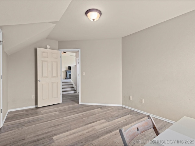 3017 Lincoln Rd, Bartlesville, OK 74006 - bedroom with wood finished floors and vaulted ceiling