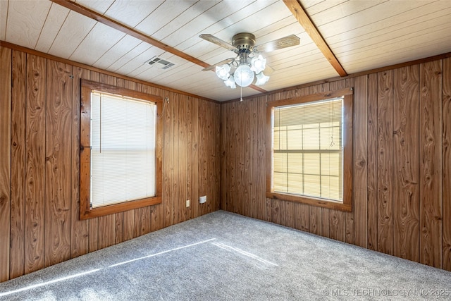 703 N Sioux Ave, Claremore, OK 74017 - spare room featuring carpet, ceiling fan, wooden walls, and wood ceiling