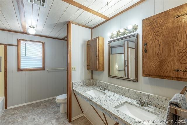703 N Sioux Ave, Claremore, OK 74017 - bathroom featuring double vanity and wood ceiling