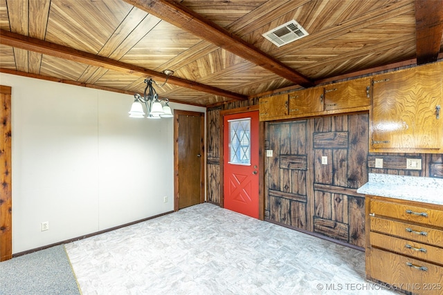 703 N Sioux Ave, Claremore, OK 74017 - empty room with a wooden ceiling with exposed beams and a chandelier
