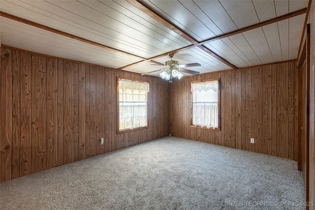 703 N Sioux Ave, Claremore, OK 74017 - spare room featuring carpet, a ceiling fan, wood ceiling, and wooden walls