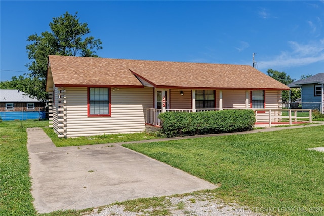703 N Sioux Ave, Claremore, OK 74017 - view of front of property with covered porch, roof with shingles, and log exterior