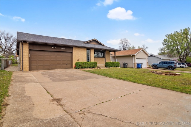 5729 E 24th Pl S, Tulsa, OK 74114 - view of front of home with brick siding, a front yard, concrete driveway, and an attached garage