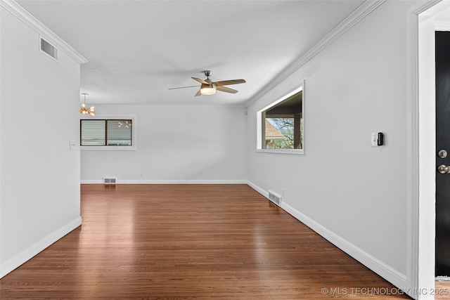 5729 E 24th Pl S, Tulsa, OK 74114 - unfurnished room featuring ornamental molding, visible vents, ceiling fan with notable chandelier, and wood finished floors