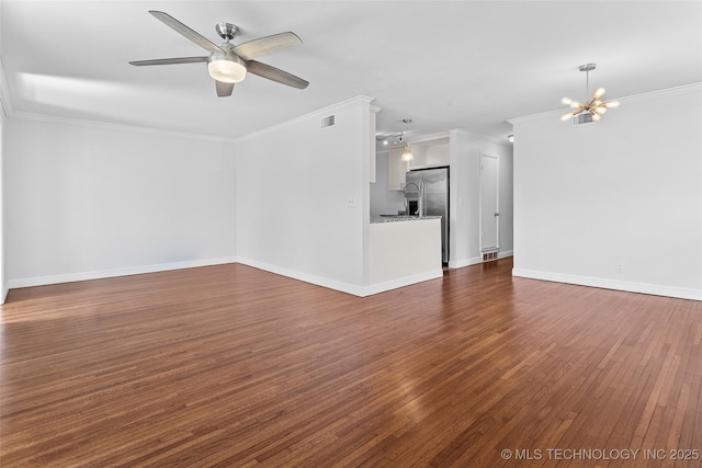 5729 E 24th Pl S, Tulsa, OK 74114 - unfurnished living room featuring dark wood finished floors, ornamental molding, ceiling fan with notable chandelier, and visible vents