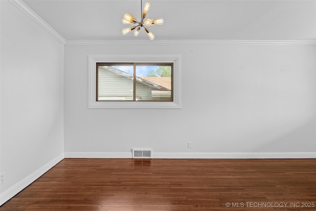 5729 E 24th Pl S, Tulsa, OK 74114 - spare room featuring visible vents, a chandelier, baseboards, ornamental molding, and wood finished floors